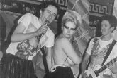 Tits out! Jordan with Sex Pistols at Andrew Logan’s Valentine party, 1976